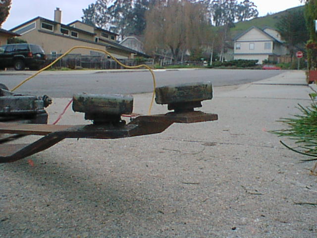 Here is a side view of the rollers. I am not sure if you can tell but I have already modified the one on the left.