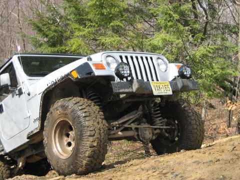 1990 Ford Bronco - This Jeep Wrangler is equipped for off-road adventures with its lifted suspension and large tires.