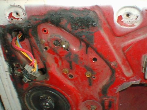 1977 Ford F-250 - Here is the regulator mounted. You can see the 4 bolts. I had to use .220 thick spacers between three of the bolts and the door to compensa…