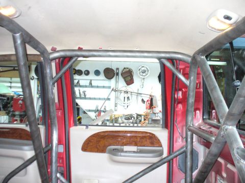 1978 Ford Bronco - Custom roll cage installed inside the interior of a red vehicle.