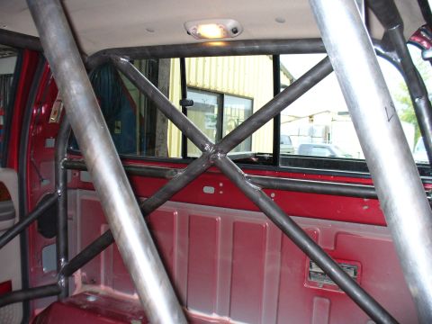 1978 Ford Bronco - This photo shows the interior of a truck with a custom roll cage installed, focusing on the structural reinforcements.
