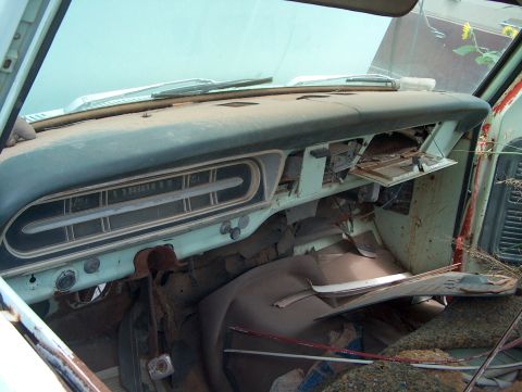 1979 Ford Bronco - The interior of a 1969 Ford F-Series truck, its distinctive instrument cluster and worn dashboard.
