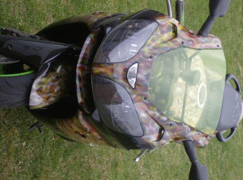 2002 Ford Mustang - Custom painted motorcycle front end with a unique flame design.