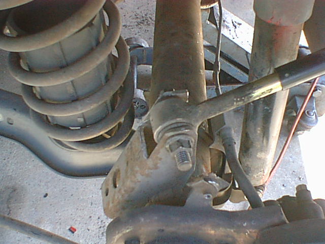 fits like a glove. the new shorter mount is just like the original! actually there is a very slight difference in the angle so i did not drill the inner hole until i had the rear in the car and used the shock bushing as a drill guide so it is square to the shock. i have put over 100K on it and have had no problems!
