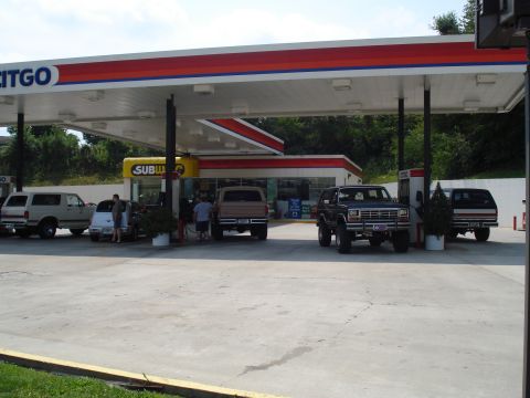 1984 Ford Bronco - A black 1980 Ford Bronco is seen at a gas station, alongside other vehicles and a Subway restaurant.