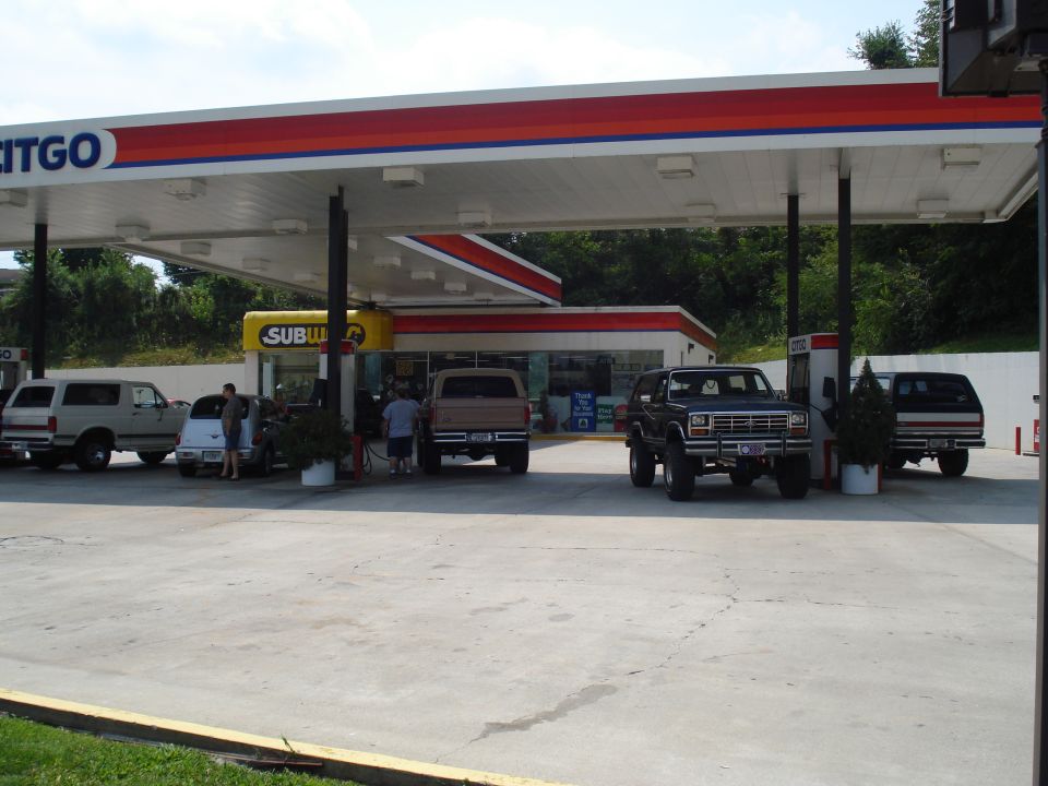 Black 1980 Ford Bronco parked at a Citgo gas station with other vehicles
