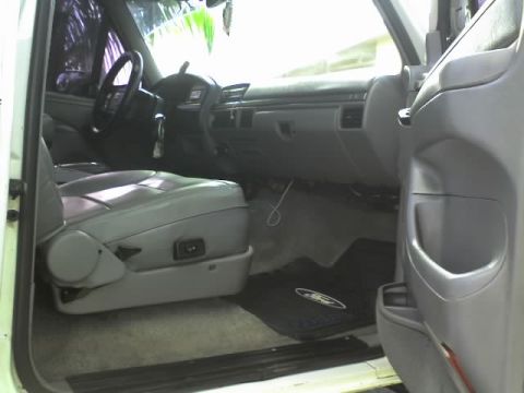 1995 Ford Bronco - Interior view of a 1995 Ford Bronco, highlighting the driver's side seat and dashboard.