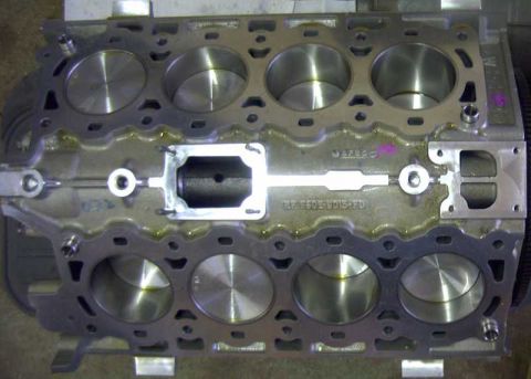 1997 Ford Taurus - Engine block with part number RF F50E-6015-FFD stamped, showing cylinder bores.