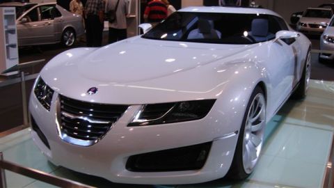 1996 Ford Probe - A white concept car is displayed at an auto show, with other vehicles visible in the background.