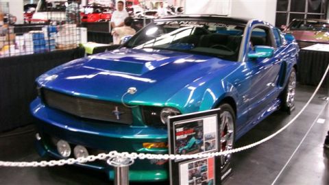 1996 Ford Probe - This custom Ford Mustang features a striking blue and teal paint job and a prominent hood scoop.