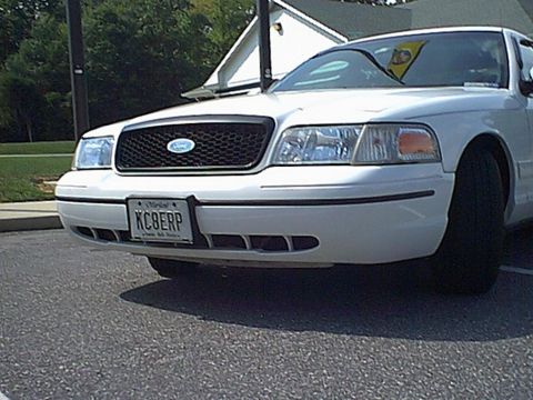 1998 Ford Crown Victoria - Front view of a 1998 Ford Crown Victoria, showing the grille, headlights, and license plate.