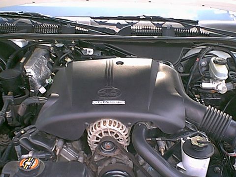 1998 Ford Crown Victoria - Engine compartment of a 1998 Ford Crown Victoria, detailing the engine and surrounding parts.