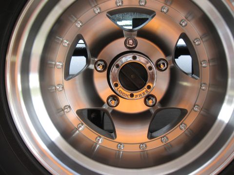 1994 Ford Bronco - Close-up of a vehicle wheel a "LOCK FREE" hub.