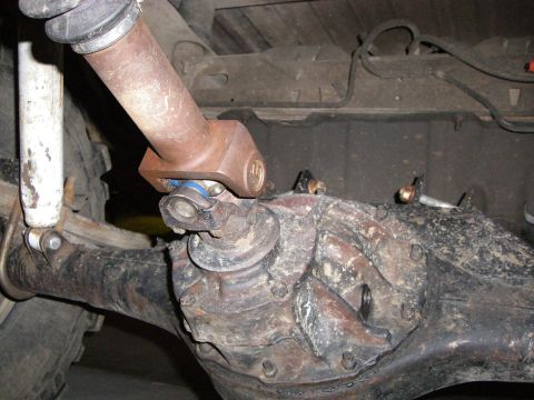 1995 Ford Bronco - Underside view of a vehicle's drivetrain components, focusing on the differential and driveshaft.