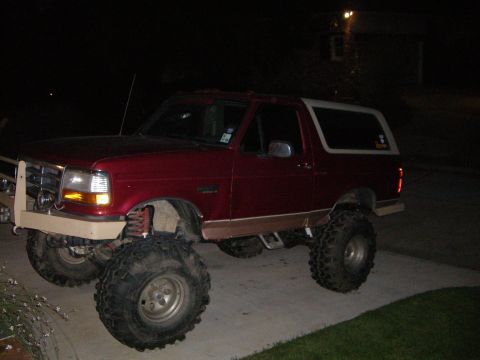1995 Ford Bronco - This modified SUV features oversized tires and a raised suspension, giving it a appearance.