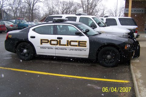 2003 Ford Crown Victoria - Western Michigan University police car with 'POLICE' text on the side.