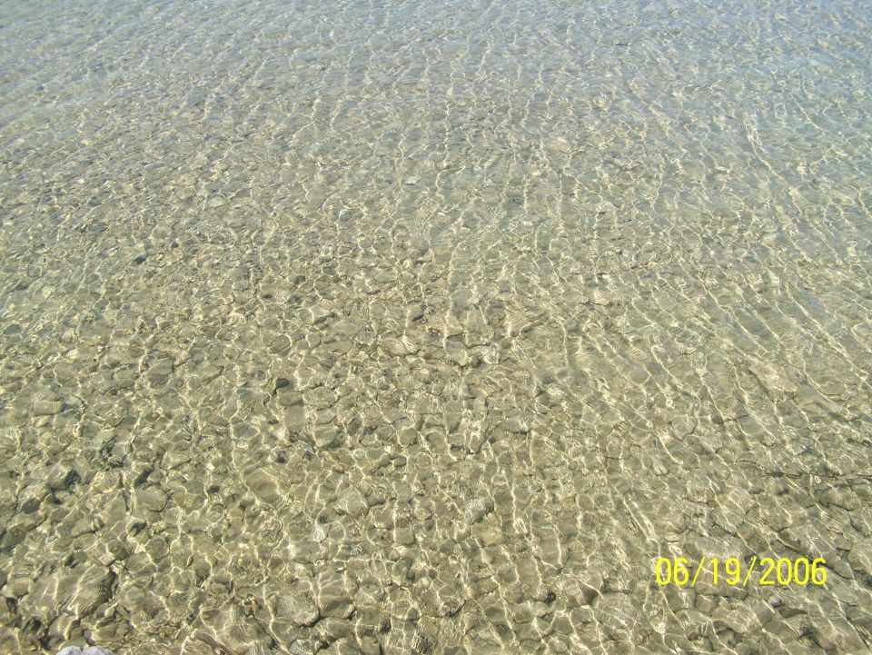 clear water over rocks with a date stamp of 05/19/2006 and SUPERMOTORS.NET logo