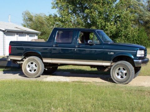 1995 Ford C-150 (Centurion Conversions) - This 1999 Ford F-250 Super Duty crew cab pickup truck is shown from the side.