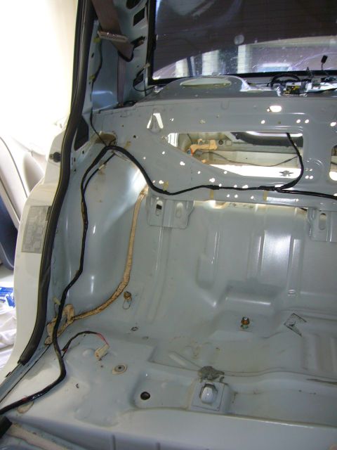 2001 Ford Crown Victoria - The interior of a 2001 Ford Crown Victoria has been stripped down to its bare metal, revealing the underlying structure and wiring.