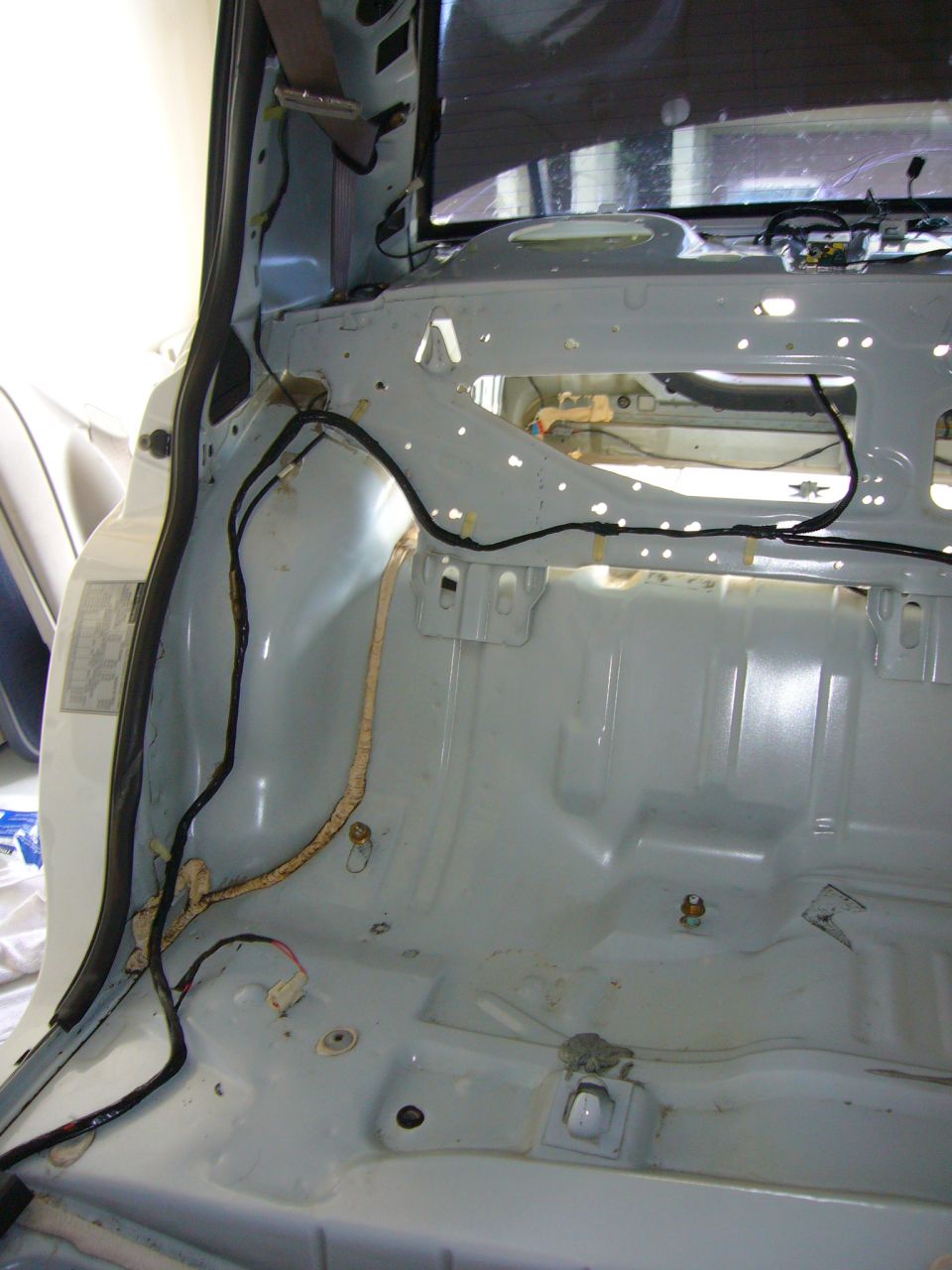 2001 Ford Crown Victoria interior stripped bare, showing wiring and structural elements
