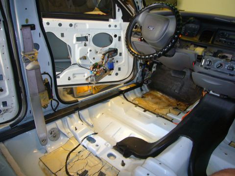 2001 Ford Crown Victoria - Interior of a 2001 Ford Crown Victoria undergoing extensive disassembly and cleaning.
