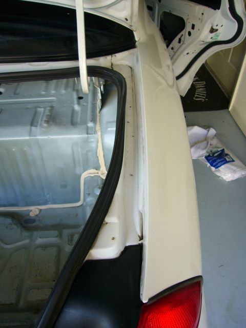 2001 Ford Crown Victoria - Close-up view of the inside of a car's trunk, focusing on the seal and surrounding panels.