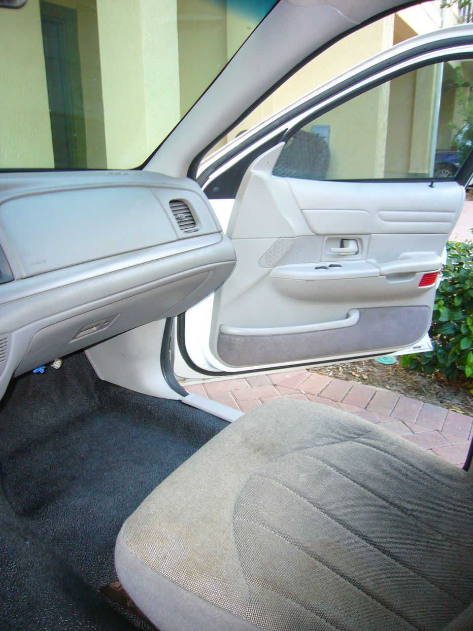 2001 Ford Crown Victoria interior showing dashboard, door panel, and front seat