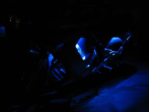 2007 Kawasaki Ninja - A motorcycle is illuminated by blue LED lights in the dark.