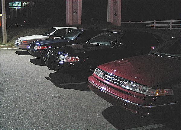 1999 Ford Crown Victoria front view, dark sedan