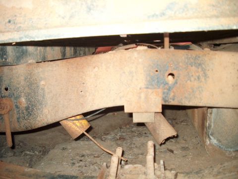 1979 Ford Bronco - Rusted frame and suspension components of an unidentified vehicle.