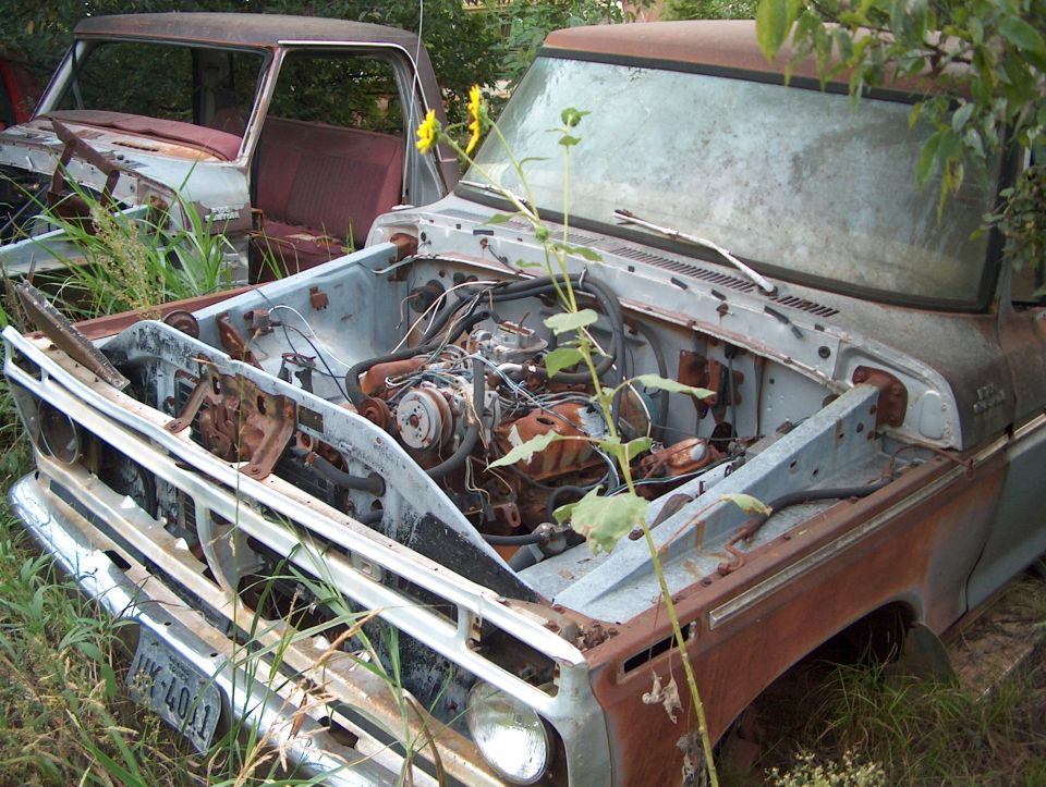 old pickup truck, hood open, engine visible, another truck behind it