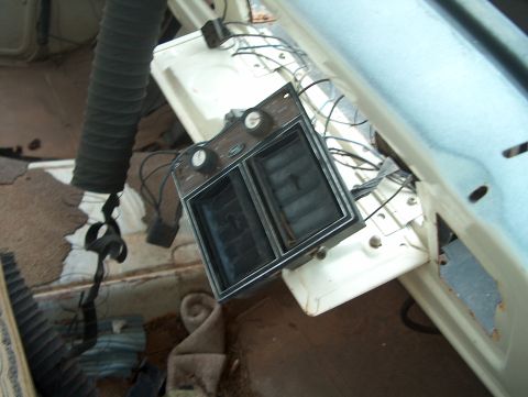 1979 Ford Bronco - Close-up of an interior vehicle part with knobs and vents, possibly from a 1979 Ford Bronco.
