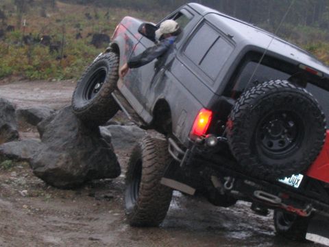 1989 Ford Bronco - A 1989 Ford Bronco navigates a rocky trail, demonstrating its off-road capabilities.