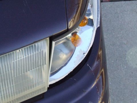 1992 Ford Crown Victoria - Close-up of the front headlight and turn signal assembly on a 1992 Ford Crown Victoria.