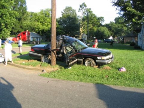 1999 Ford Crown Victoria - This 1999 Ford Crown Victoria sustained heavy damage after colliding with a utility pole.