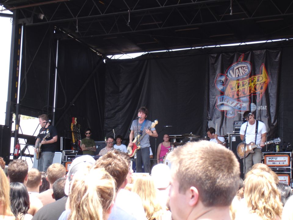 Band performing on stage at Vans Warped Tour 07, with audience in foreground