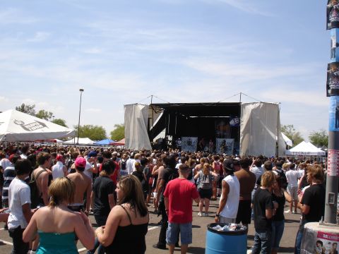 1992 Ford F-150 - A large crowd watches a band perform on stage at an outdoor event.