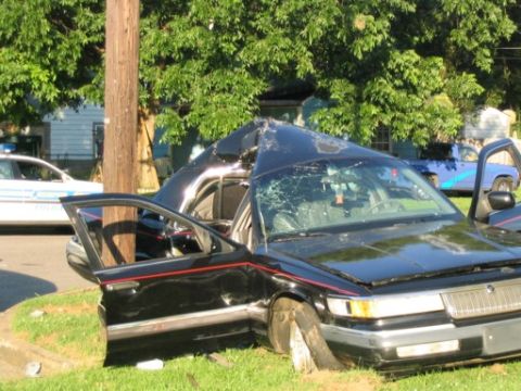 1999 Ford Crown Victoria - This 1999 Ford Crown Victoria sustained severe damage to its roof and windshield.