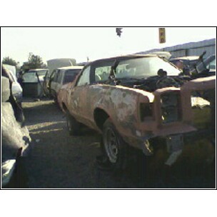 1973 Ford Ranchero - Junkyard find: a 1973 Ford Ranchero in rough condition with multiple other vehicles visible.
