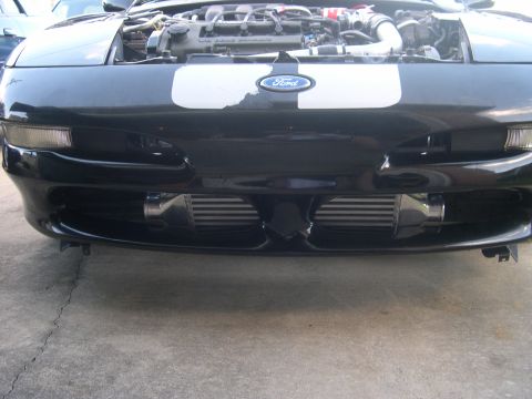 1997 Ford Probe - Front view of a 1997 Ford Probe, engine exposed, revealing twin intercoolers.
