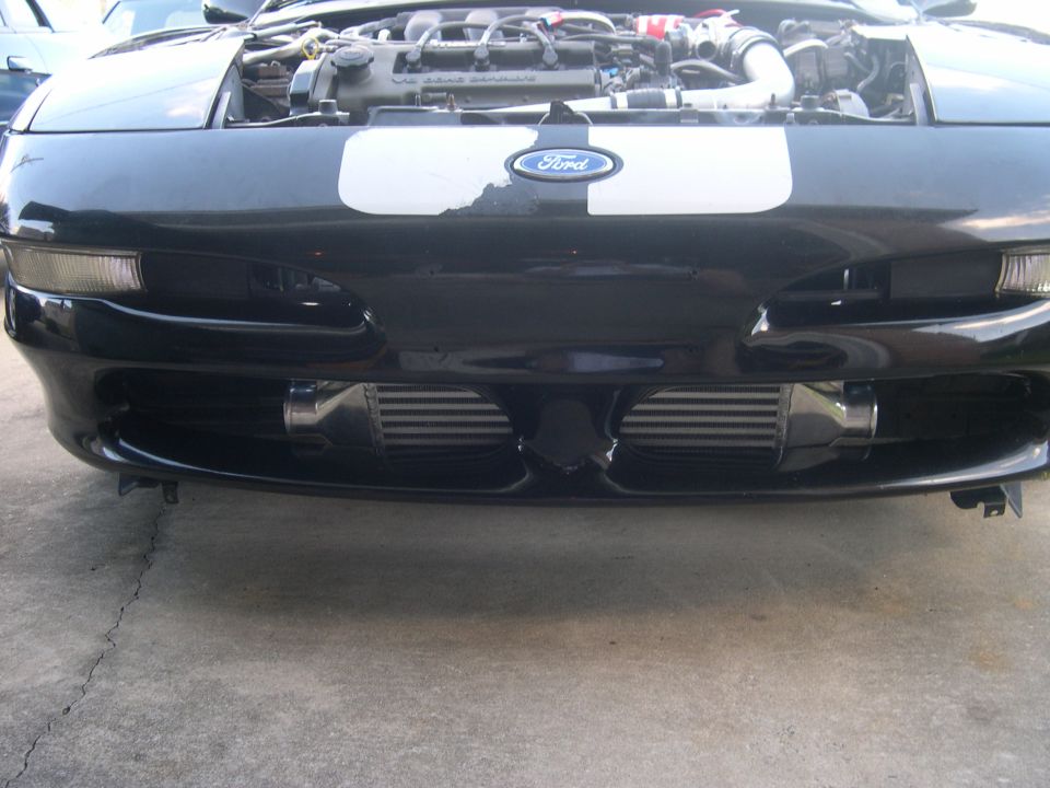 1997 Ford Probe front with hood open, twin intercoolers visible