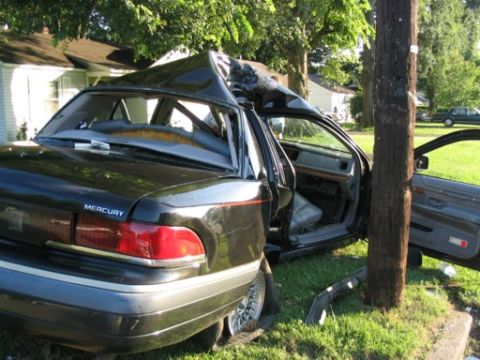 1999 Ford Crown Victoria - This Mercury Grand Marquis sustained major roof damage after colliding with a utility pole.