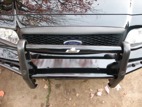 2000 Ford Crown Victoria - Front view of a 2000 Ford Crown Victoria showing the grille and a black push bar.