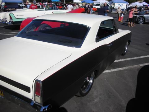 1998 Ford Crown Victoria - Rear-quarter view of a custom two-door hardtop in white over black two-tone paint at an outdoor car show.