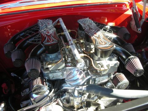 1998 Ford Crown Victoria - Heavily detailed dual-carburetor chrome V8 engine bay with custom black-and-orange pinstriped intakes and multiple K&N cone filters.