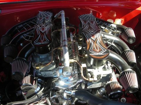 1998 Ford Crown Victoria - Close-up of a show-detailed dual-carb chrome V8 engine with custom airbrushed intake covers and an array of cone air filters.