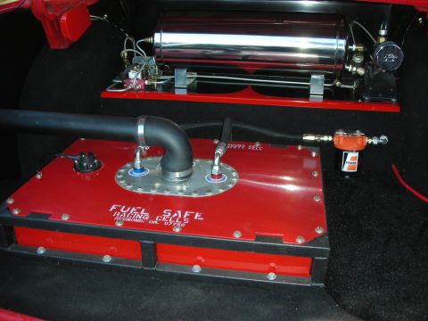 1998 Ford Crown Victoria - Custom trunk installation showing a red Fuel Safe racing cell, polished cylindrical air tank and inline fuel filter.