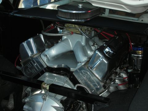 1998 Ford Crown Victoria - built V8 engine with polished aluminum intake, chrome valve covers, and a round chrome air cleaner displayed under an open hood.
