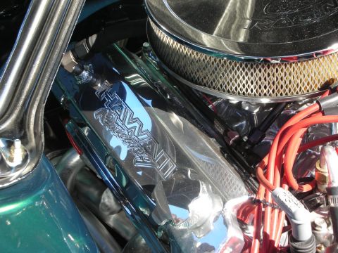 1998 Ford Crown Victoria - polished engine-bay panel engraved with TANNER Racing sits beside a chrome air cleaner and red plug wires.