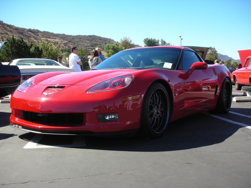 Red Chevrolet Corvette Z06 coupe parked at an outdoor car show